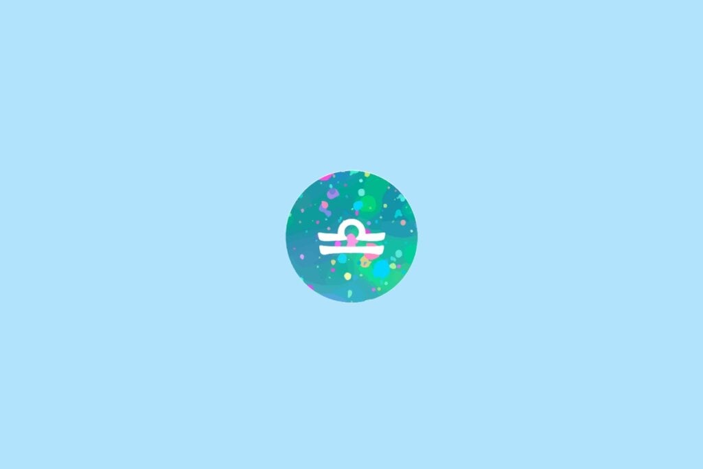 Ícone do signo de Libra em um círculo colorido com fundo azul-claro