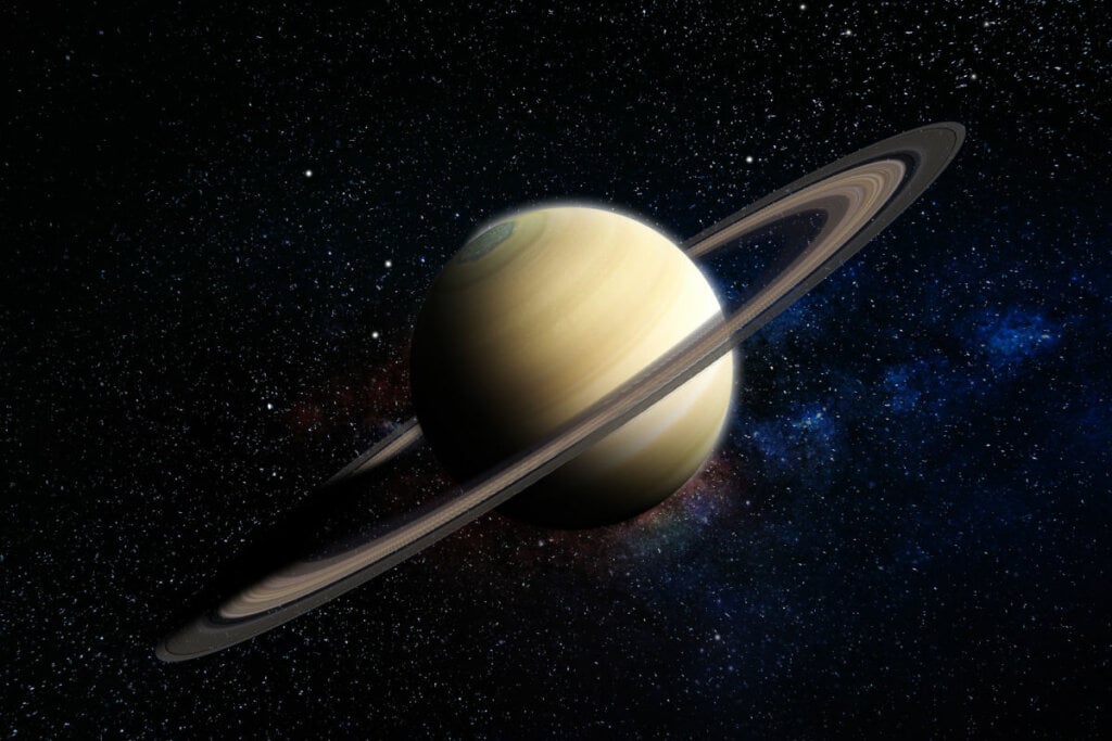 Ilustração do planeta Saturno em fundo azul-escuro estrelado 