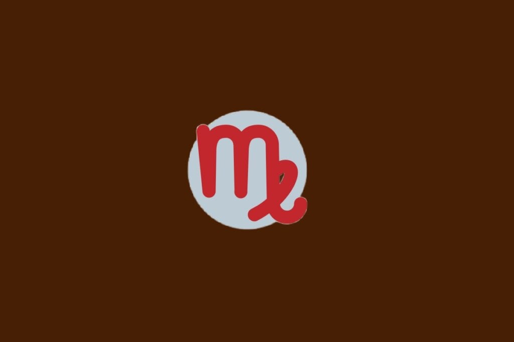 Horóscopo do dia: previsão para os 12 signos em 23/04/2025 60 Ilustração do signo de Virgem, com símbolo vermelho parecido com a letra “M” com curva final, sobre fundo cinza e marrom-escuro