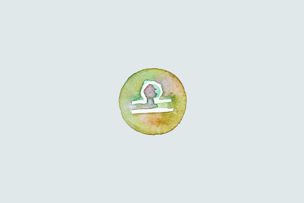 Veja as previsões do baralho cigano de junho para os 12 signos 66 Símbolo do signo de Libra com linha horizontal e arco acima, sobre fundo colorido em estilo aquarela